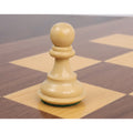 Heavily weighted boxwood pawn chess piece with felted base on a wooden board.
