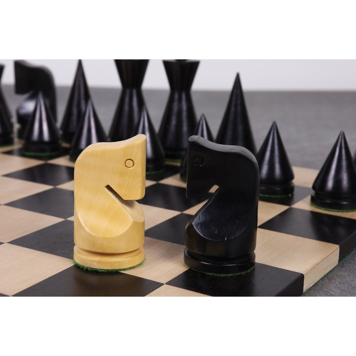 Handcrafted ebonised and natural boxwood Knights from the Russian Poni minimalist chess collection.