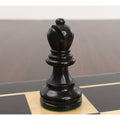 Close-up of a single ebonised boxwood rook from the Reykjavik Series Staunton chess set on a board.