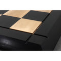 25 inch luxury Drueke style chessboard displayed on a wooden table in a lifestyle setting.