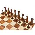 High-angle view of the golden rosewood Herman Ohme chess pieces arranged on the board.