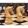 Close-up of a dark rosewood Imperial Staunton king standing on a glossy chessboard.