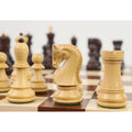 Handcrafted boxwood knight and rook pieces arranged on an eDensity wooden chessboard.