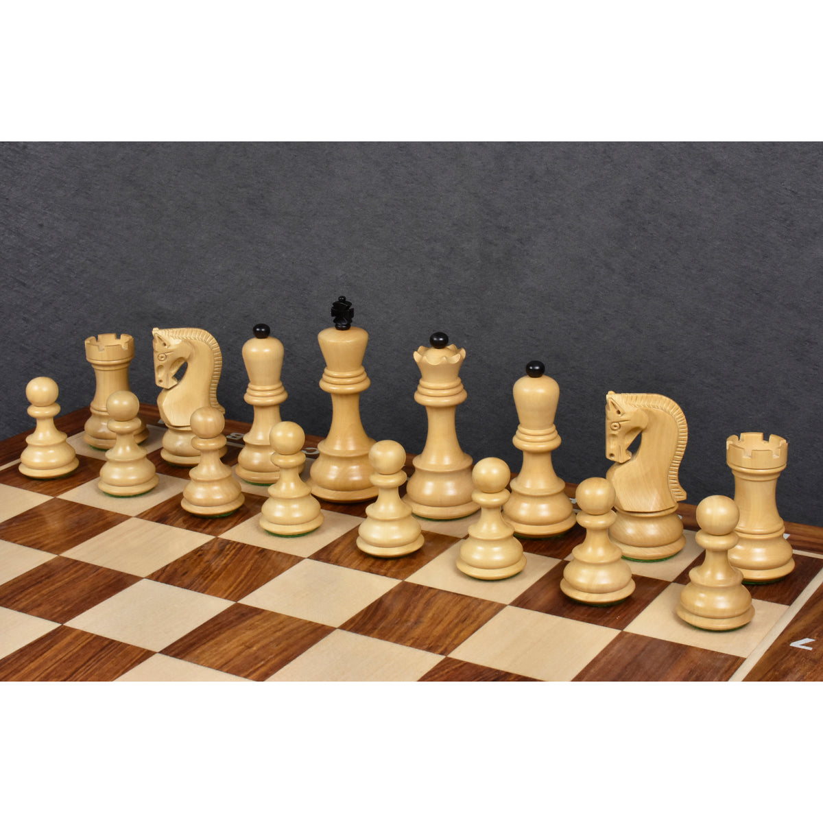 Boxwood chess pieces from the 3.9 inch Russian Zagreb series set up on a board.