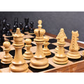 Premium Carvers' Art chess set setup on an ebony and maple luxury chess board.