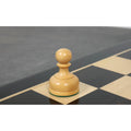 Detailed view of a weighted white boxwood pawn from the Staunton Library Series.