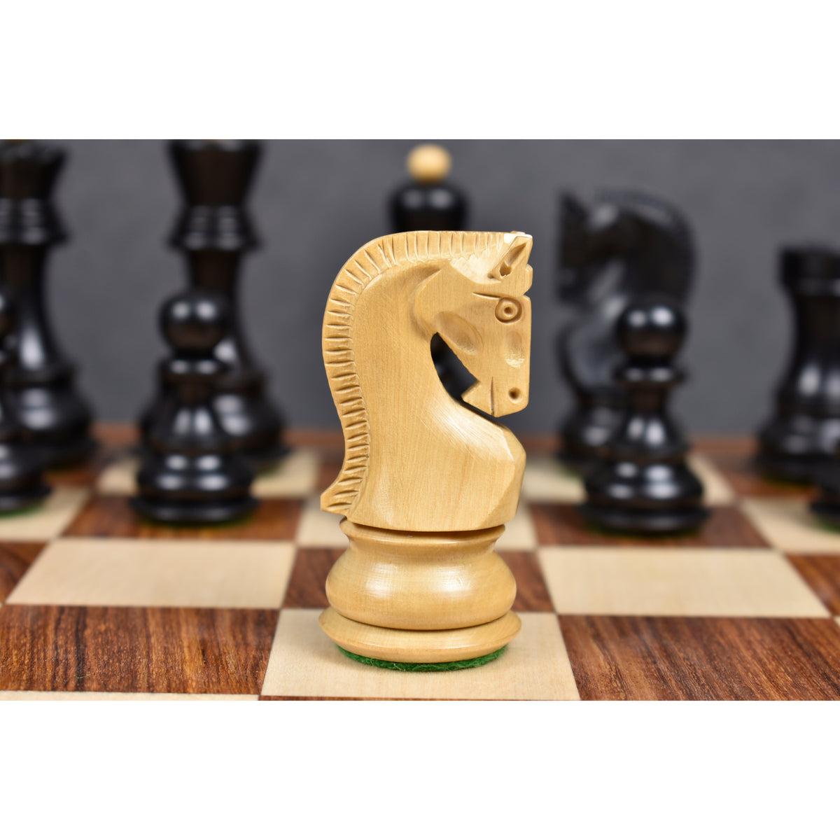 Profile close-up of a carved boxwood knight piece from the 3.9 inch Russian Zagreb chess set.