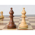 Golden rosewood and boxwood French Grandmaster bishop pieces side by side.