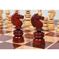 Bud rosewood Knights from the 4.3 inch St. George Pre-Staunton Calvert chess pieces set on a wooden board.