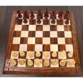 Overhead view of the 3.1 inch Pro Staunton chess pieces set on a matching wooden board.