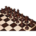 An angled top-down view of the Rosewood Dubrovnik chess pieces highlighting the wood grain and finish.