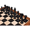 Complete dark ebony Arthur Staunton chess army arranged on a board.