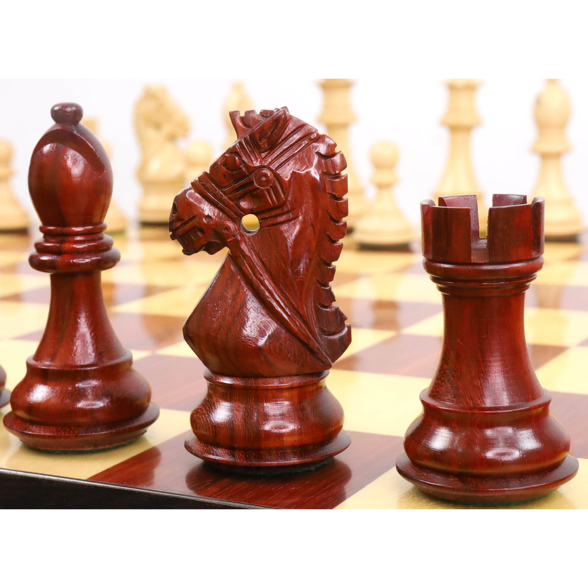 Detailed close-up of bud rosewood pieces highlighting the precise carving of the Bridle Staunton knight.