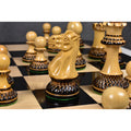 Detailed close-up of a hand-carved natural boxwood knight from the Parker Staunton chess pieces collection.