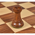 Detailed view of the handcrafted Rook from the Professional Staunton Golden Rosewood chess set.