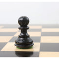 Polished ebonised boxwood pawn from the Zagreb collection with a green felt base for smooth movement.