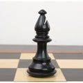 Black ebonised bishop from the 3.7" British Staunton weighted chess set resting on a chessboard.