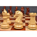 Close-up of a carved Boxwood knight from the 3.9" Craftsman Staunton chess set positioned on a glossy wooden board.