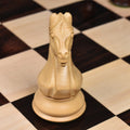 Frontal close-up of a carved boxwood knight piece from the Majestic Series Staunton chess set.