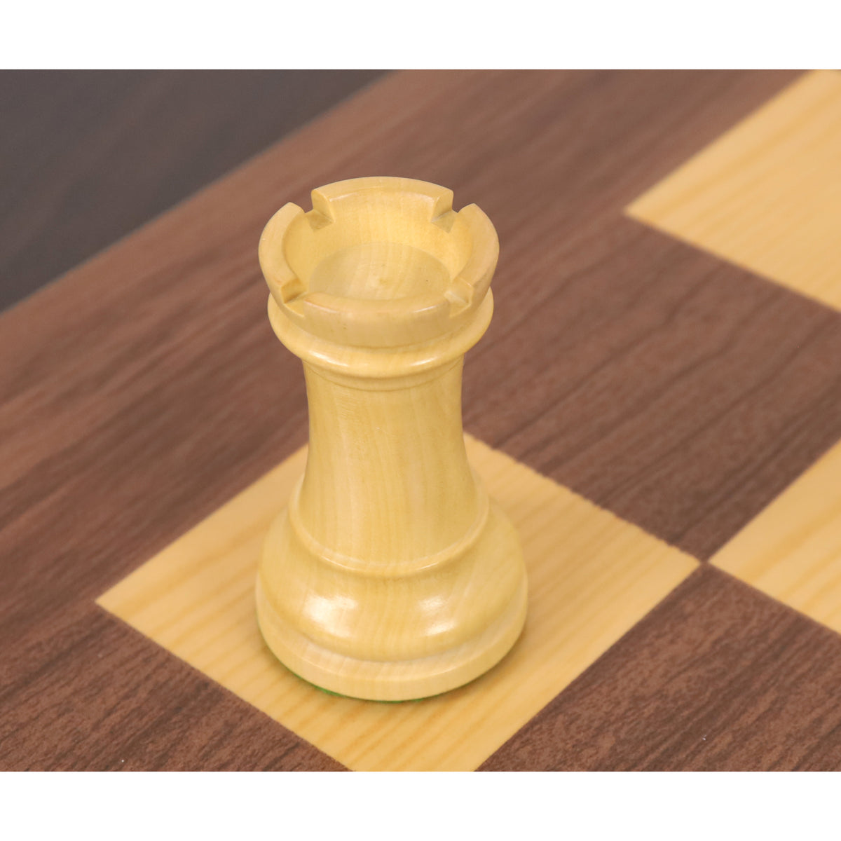 Elevated view of boxwood French Chavet tournament chess rook.