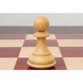 Close-up of a single light boxwood pawn from the 4-inch Sleek Staunton luxury chess set on a board.