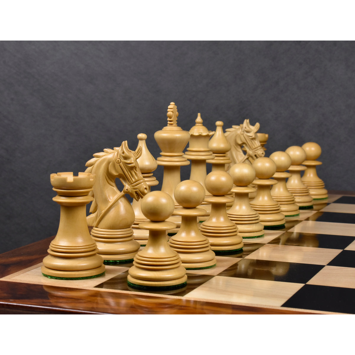 Premium boxwood chessmen from the 4.3 inch Napoleon luxury Staunton collection arranged on a board.