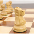 Close-up of a single golden rosewood rook from the Reykjavik Series Staunton chess set.