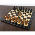 Full chessboard setup featuring the St. John Pre-Staunton Calvert chess pieces in ebony and antique wood.