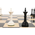 Close-up of black and white Turkish Tower bishop chess pieces on board