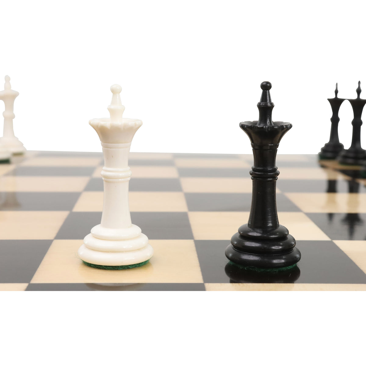 Close-up of black and white Turkish Tower bishop chess pieces on board