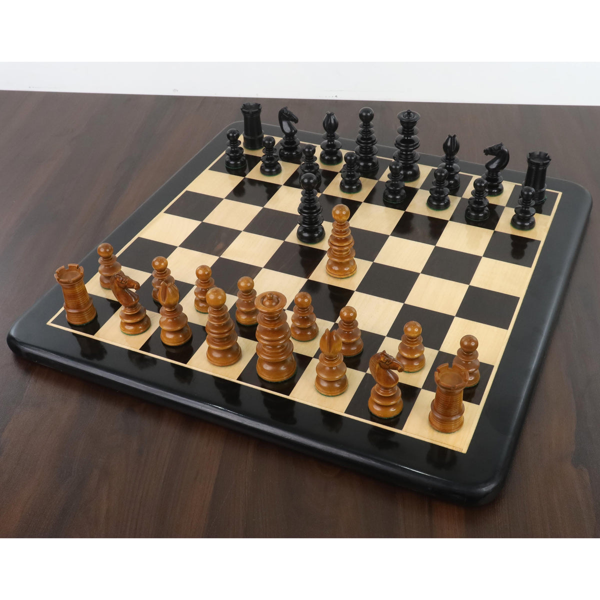 Full St. John Calvert chess set in ebony wood arranged on a 19-inch board.