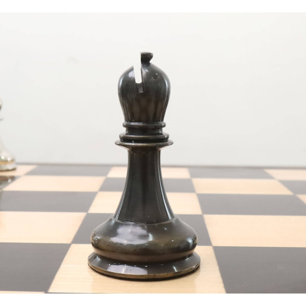 Elegant grey brass metal bishop piece from the 1849 Jacques Staunton luxury collection.