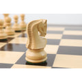 Detailed hand-carving on the back of a natural boxwood Zagreb knight on a premium chessboard.
