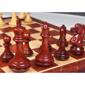 Close-up of the Bud Rosewood King, Queen, and officers on a chessboard.