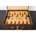 Velvet-lined interior tray with custom-molded slots inside a tan brown chess storage box.
