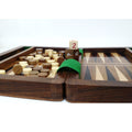 Close-up of dice and game pieces on a 6-inch wooden backgammon board.