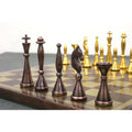 Profile view of antique copper brass chess pieces showing their modern, slender luxury design.
