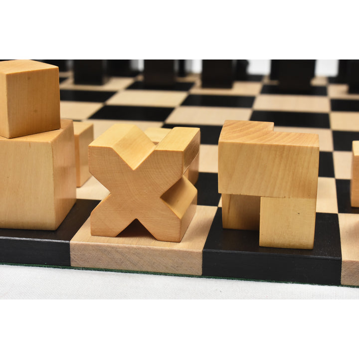 Minimalist cross-shaped bishop and L-shaped knight Bauhaus pieces on an ebony wood board.