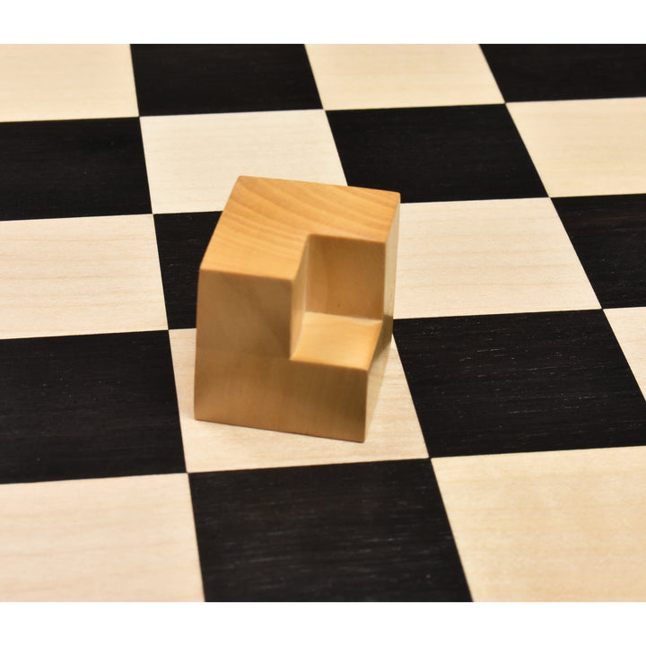 Close-up of a minimalist L-shaped Bauhaus knight piece crafted from boxwood.