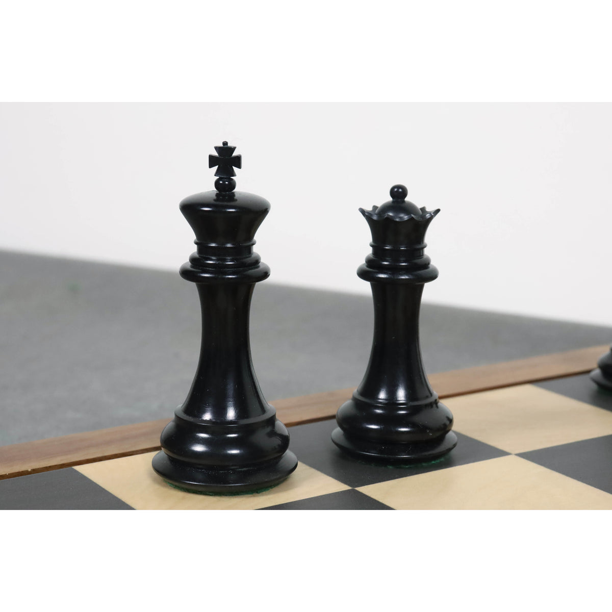 Black stained camel bone King and Queen pieces from the 1849 Jacques Cook Staunton series.
