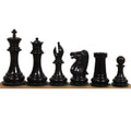 Lineup of black stained camel bone chess pieces featuring the King, Queen, Bishop, Knight, Rook and Pawn.