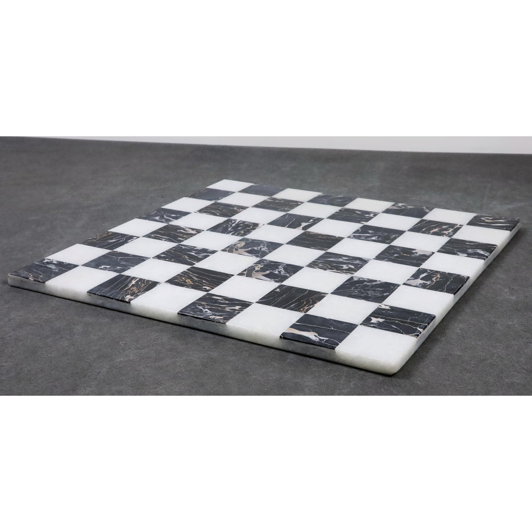 Contemporary 15 inch marble chess board in black and white stone on a grey background.