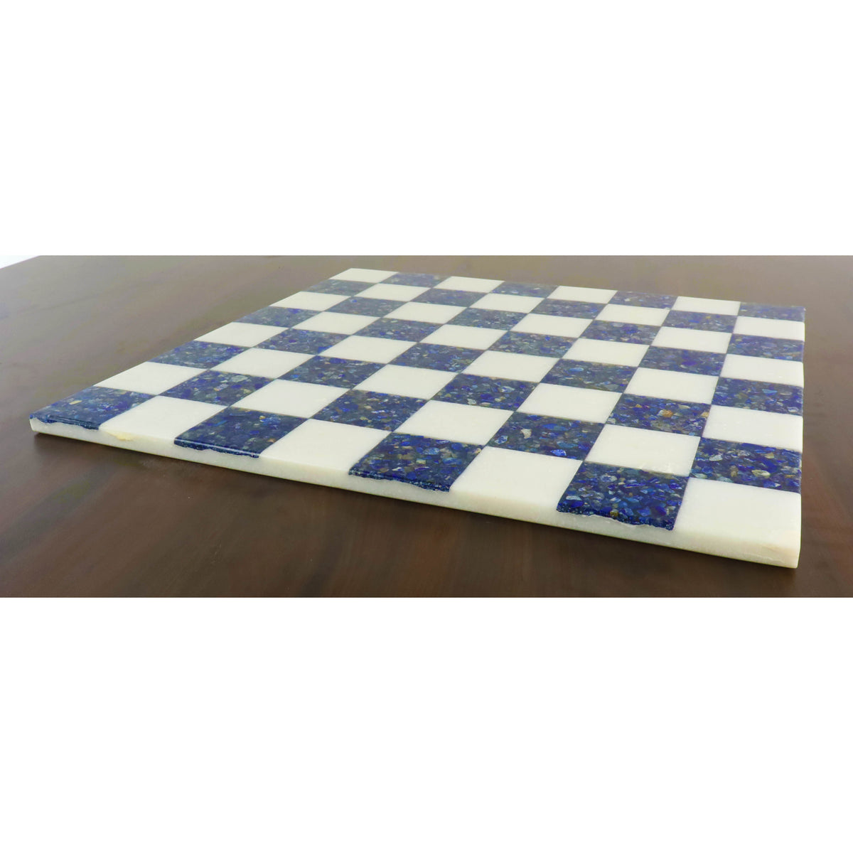 Side profile of a slim 18 inch borderless marble chess board in lapis lazuli blue and white.