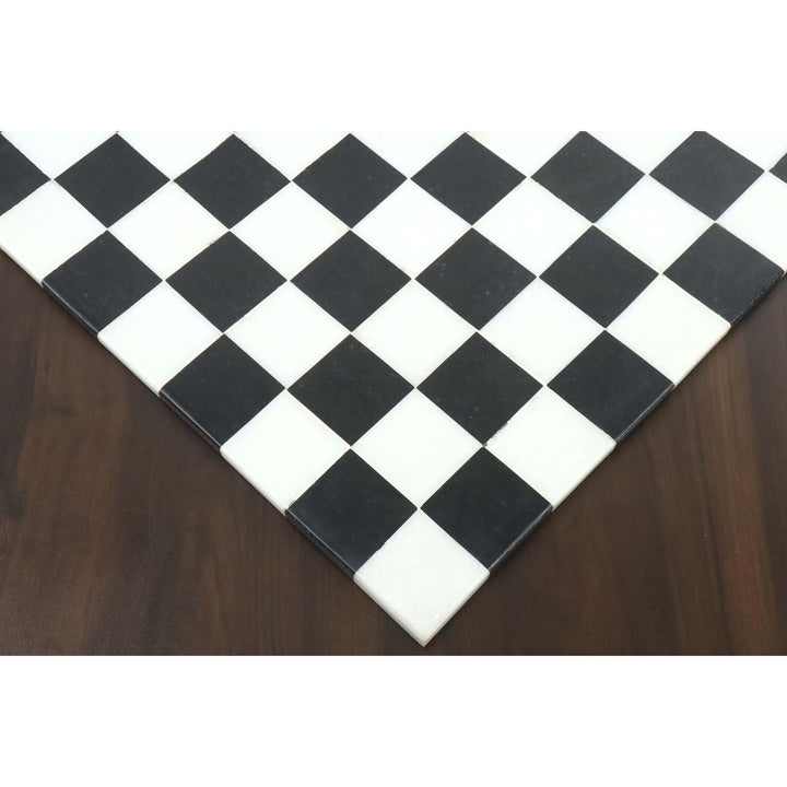 Close-up of the seamless borderless edge on a black and white marble stone chess board.