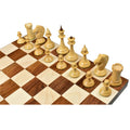Slender boxwood chess pieces from the 1950s Soviet Latvian reproduction set on a checkerboard.