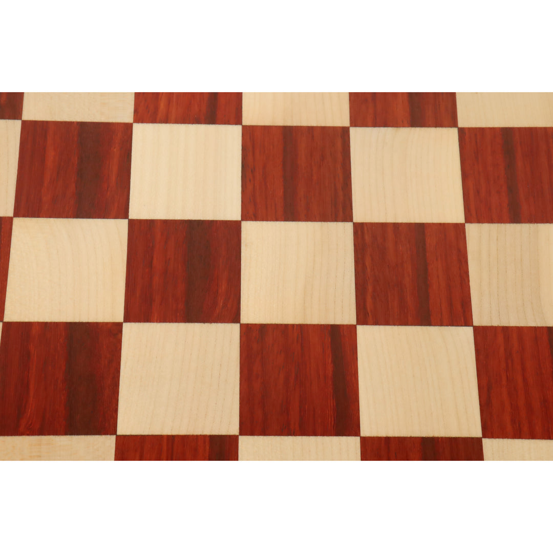 Symmetric top-down view of the alternating bud rosewood and maple wood squares on a chess board.