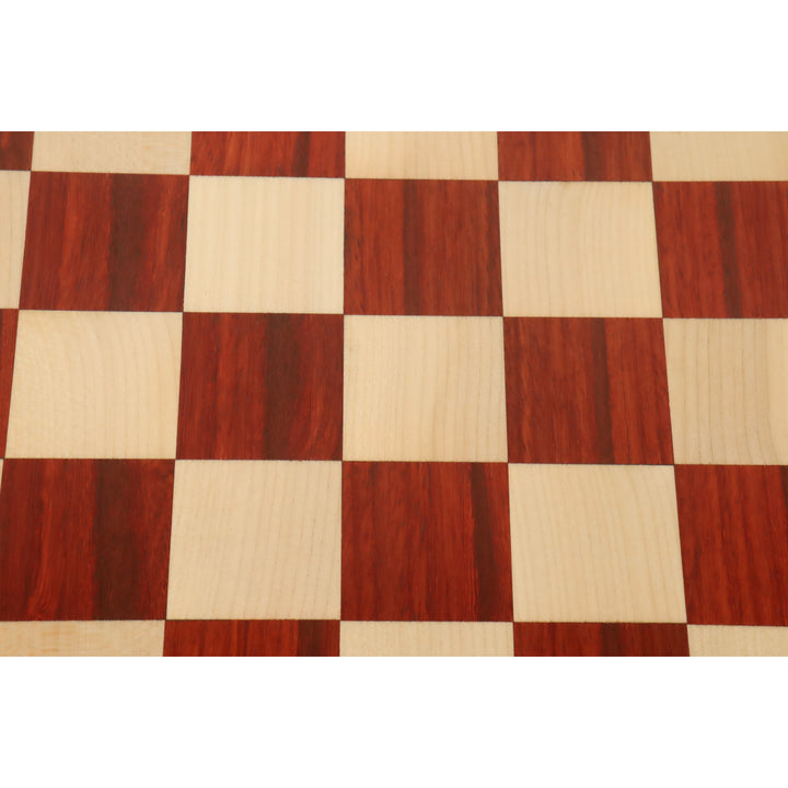 Symmetric top-down view of the alternating bud rosewood and maple wood squares on a chess board.