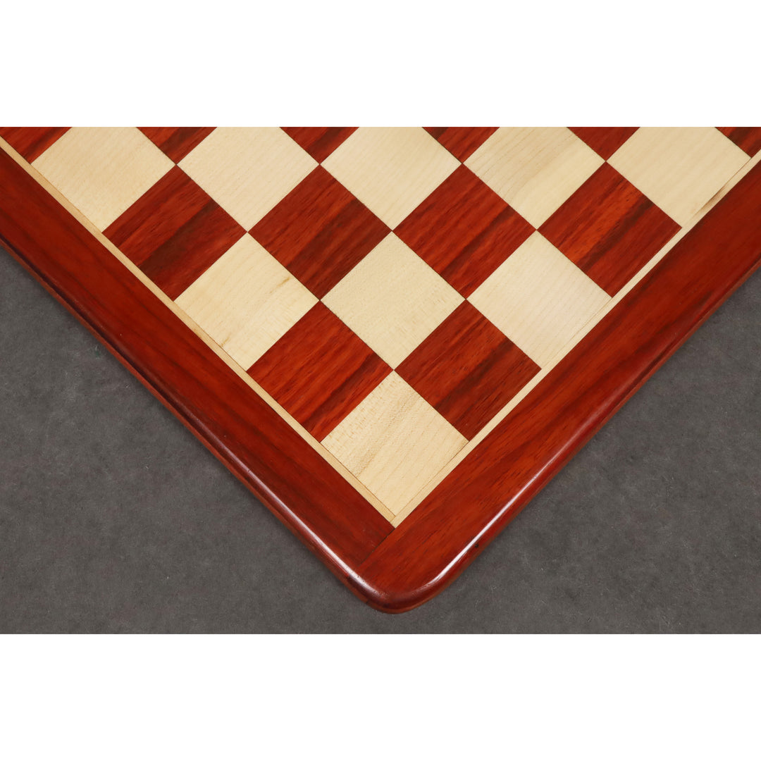 Precision wood inlay detail of a 19 inch bud rosewood and maple chess board with 50 mm squares.