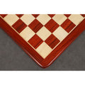 Precision wood inlay detail of a 19 inch bud rosewood and maple chess board with 50 mm squares.