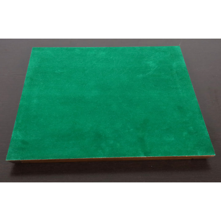 Green felted base of a Drueke style chess board to prevent scratches on surfaces.